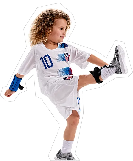 Child playing soccer while wearing pediatric braces